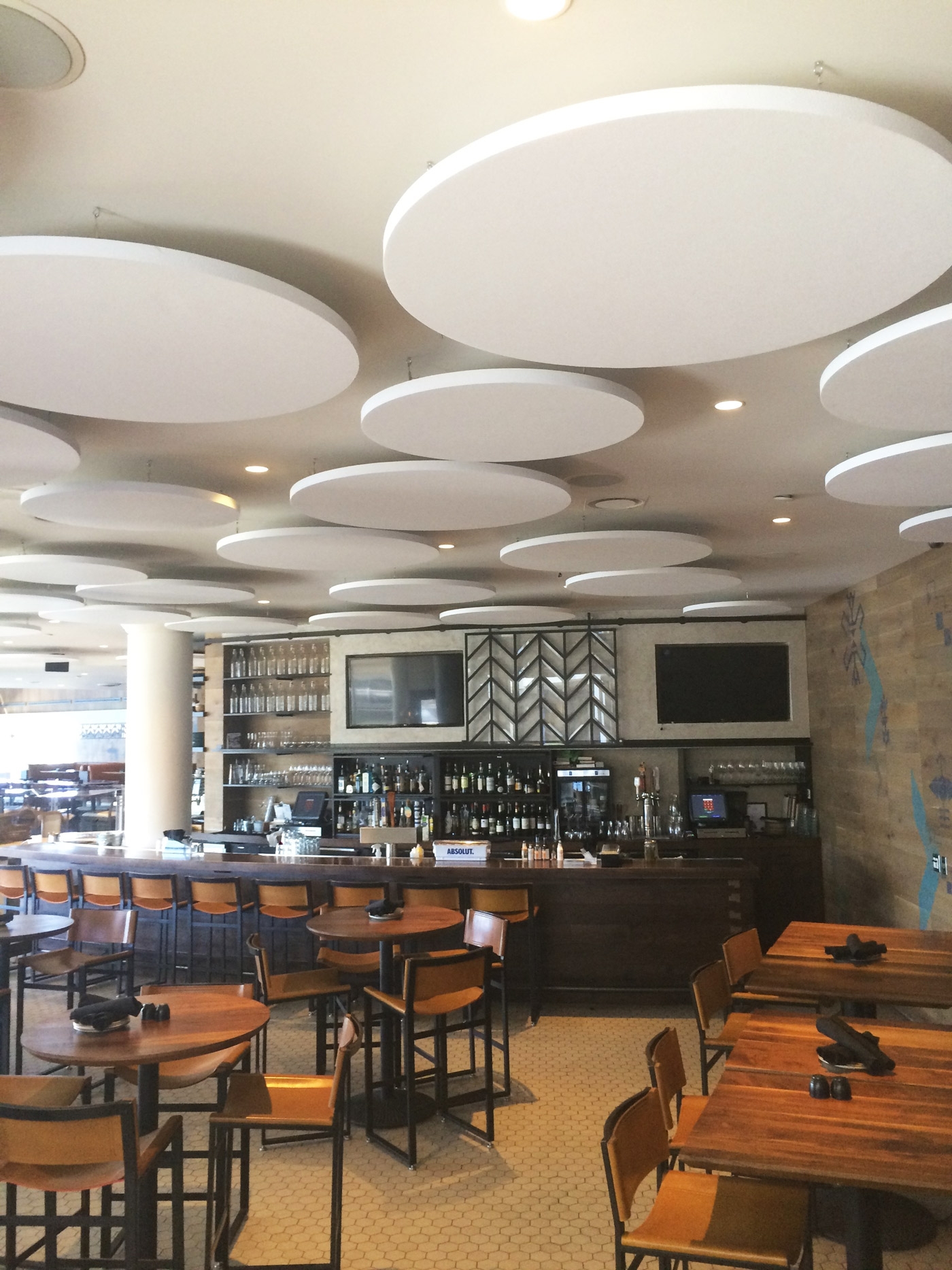 restaurant with ceiling cloud acoustic treatment